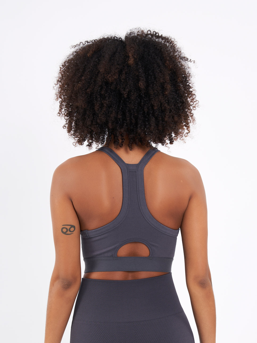 A Woman Wearing Anthracite Color Zen Perfect Seamless High-Impact Sports Bra With Padding