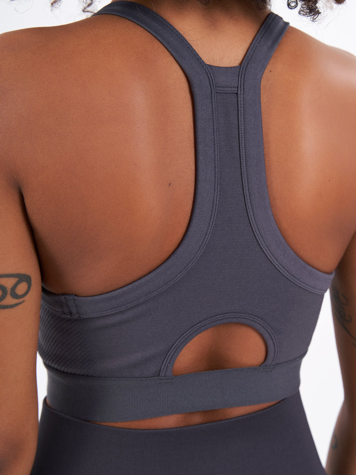 A Woman Wearing Stone Coal Color Zen Perfect Seamless High-Impact Sports Bra With Padding