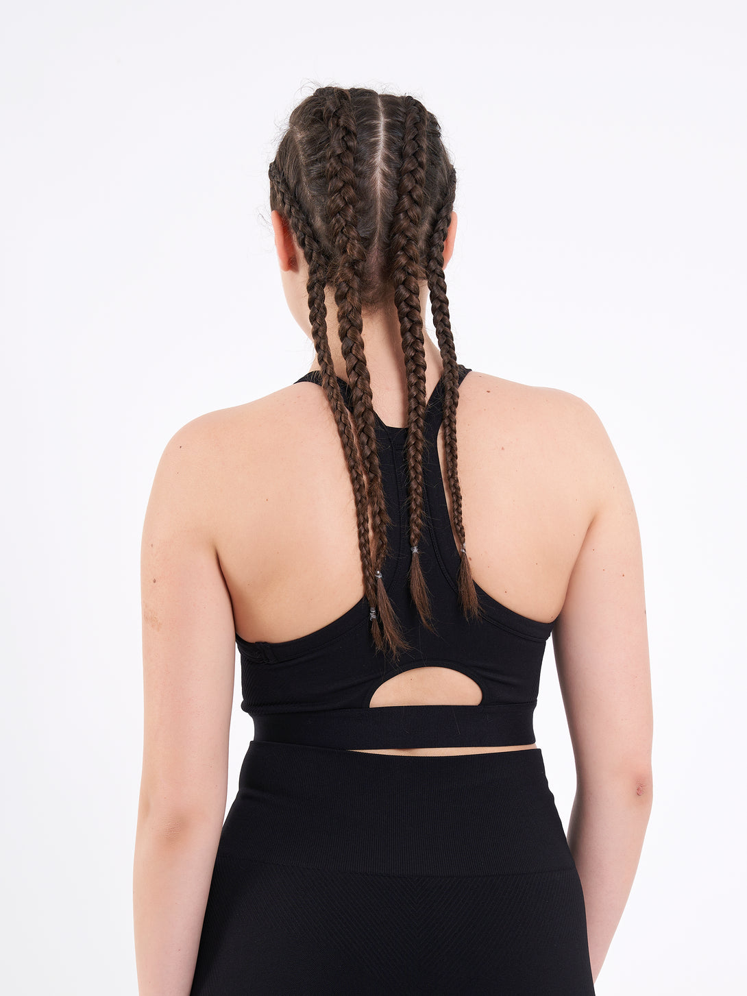 A Woman Wearing Deep Black Color Zen Perfect Seamless High-Impact Sports Bra With Padding