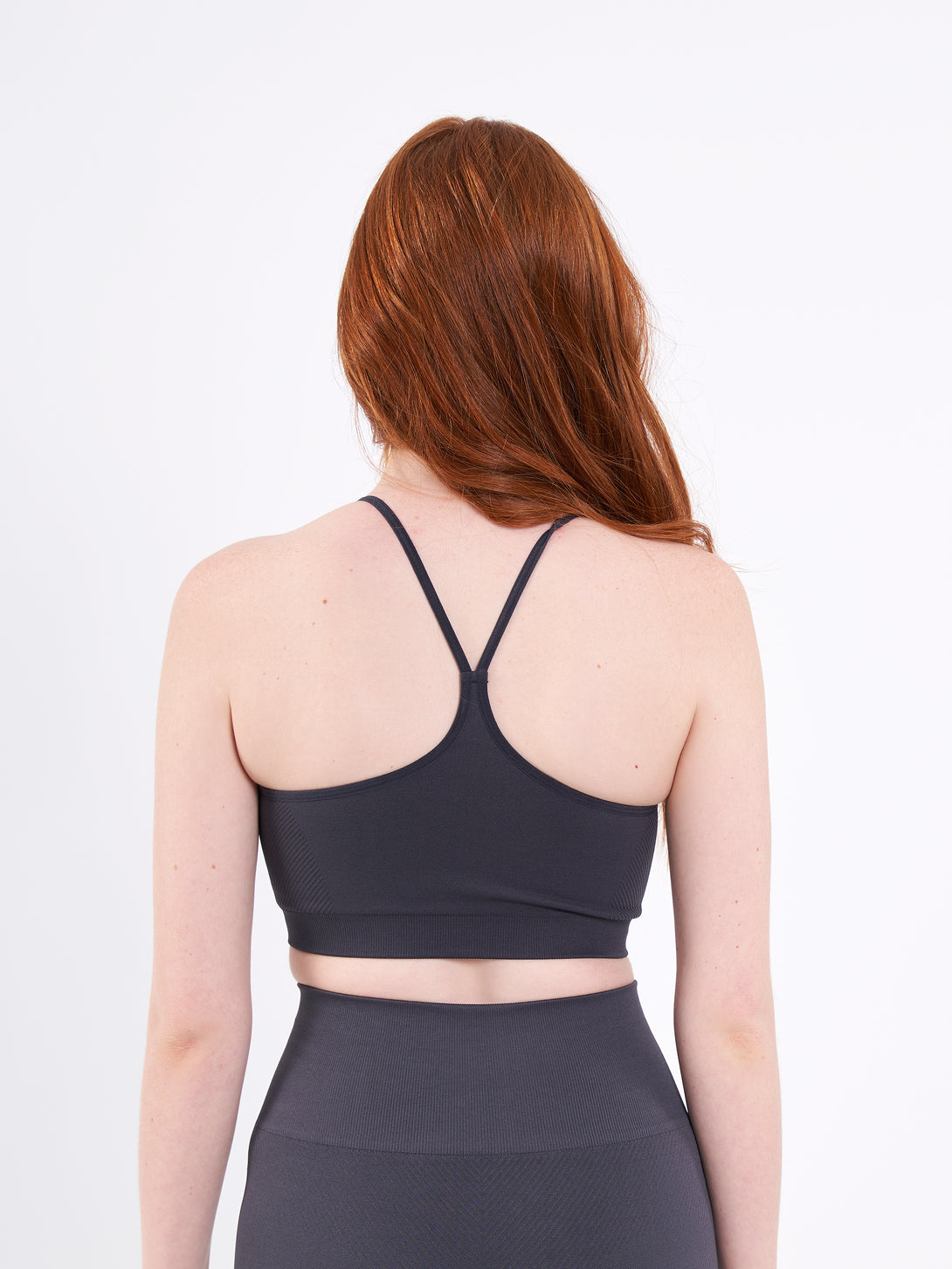 A Woman Wearing Anthracite Color Zen Perfect Low Impact Bra