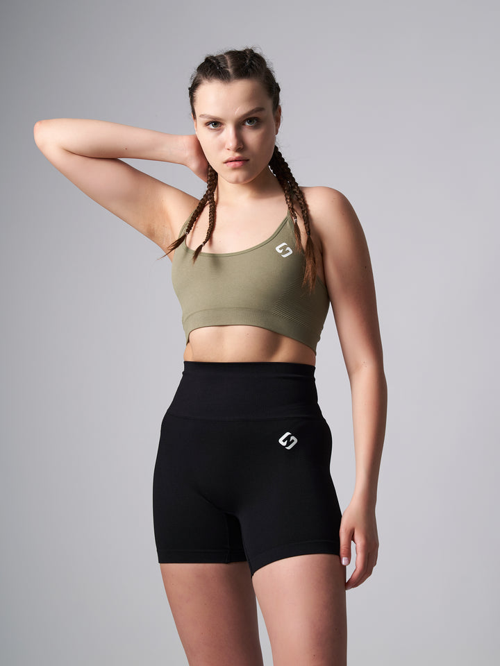 A Woman Wearing Olive Color Zen Perfect Low Impact Bra