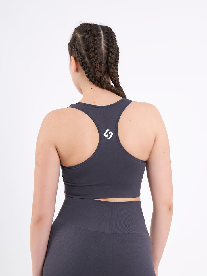 A Woman Wearing Anthracite Color Zen Perfect Seamless Mid-Impact Sports Bra With Padding