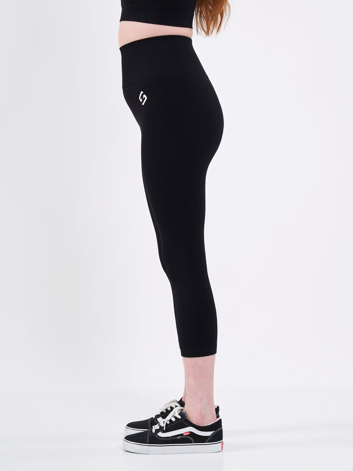 A Woman Wearing Deep Black Color Zen Perfect Seamless High-Waist Crop Leggings. Perfect Fit