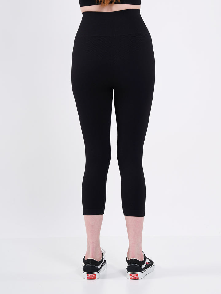 A Woman Wearing Deep Black Color Zen Perfect Seamless High-Waist Crop Leggings. Perfect Fit