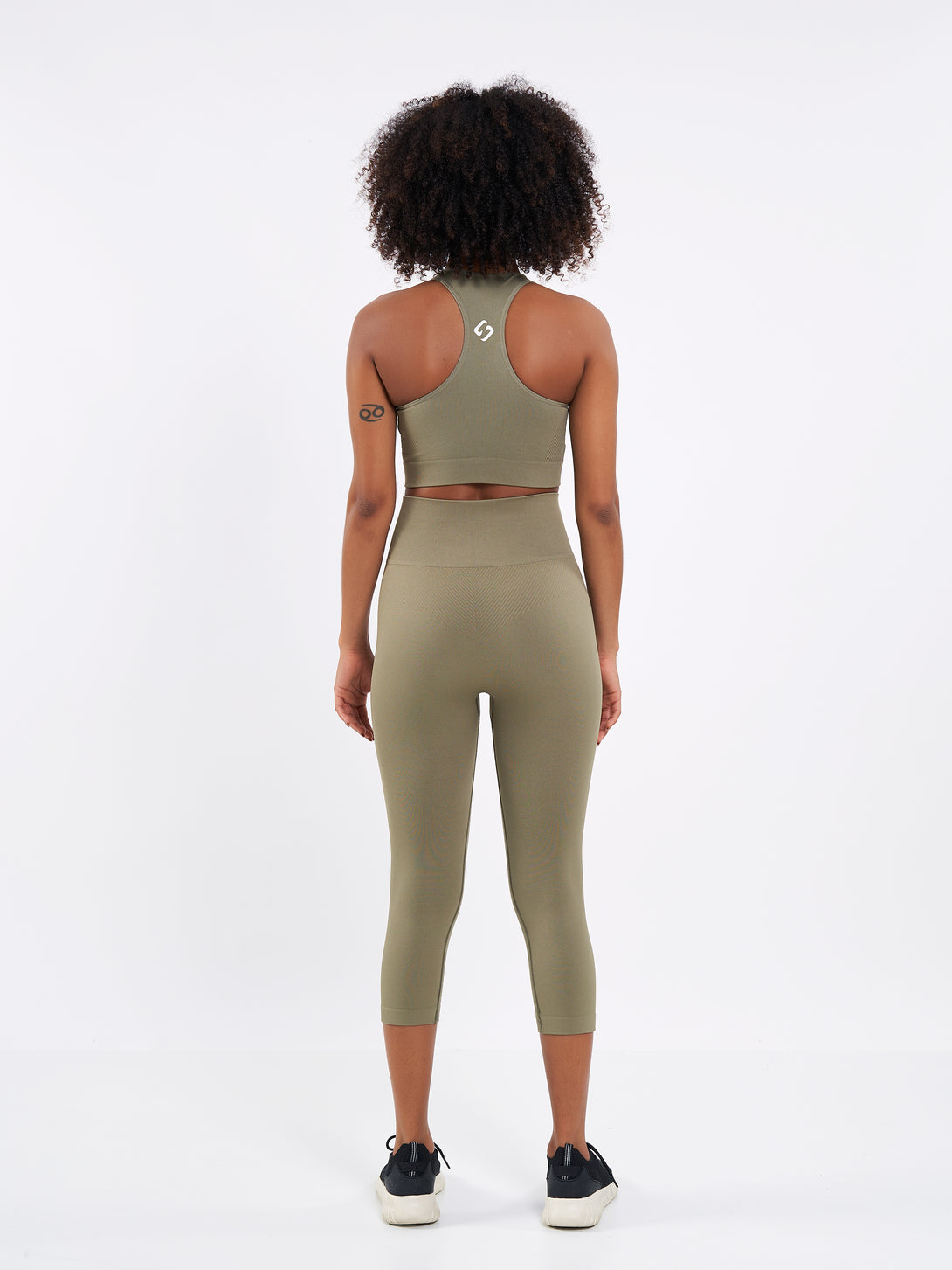A Woman Wearing Olive Color Zen Perfect Seamless High-Waist Crop Leggings. Perfect Fit