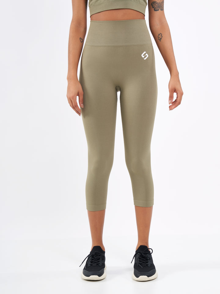 A Woman Wearing Olive Color Zen Perfect Seamless High-Waist Crop Leggings. Perfect Fit