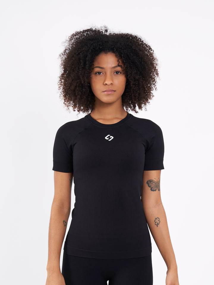 A Women Wearing Deep Black Color Zen Perfect Seamless T-Shirt. Extra-Soft