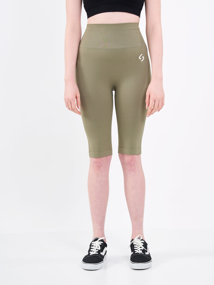 A Woman Wearing Olive Color Zen Perfect Seamless High-Waist Longline Shorts. Perfect Fit