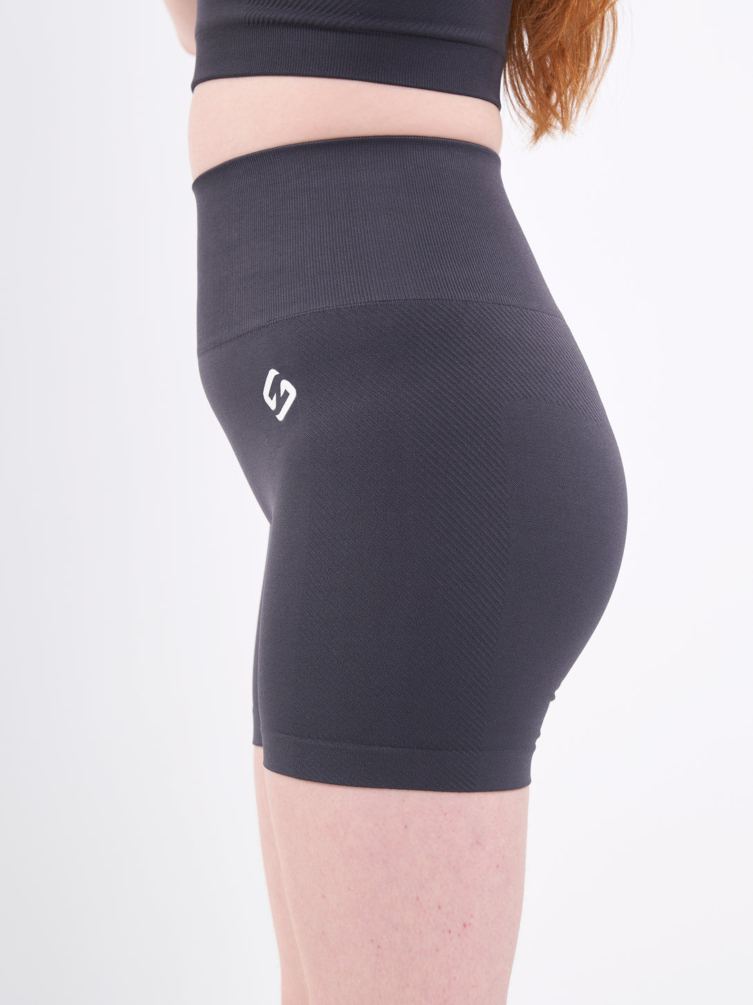 A Woman Wearing Anthracite Color Zen Perfect Seamless High-Waist Shorts. Perfect Fit