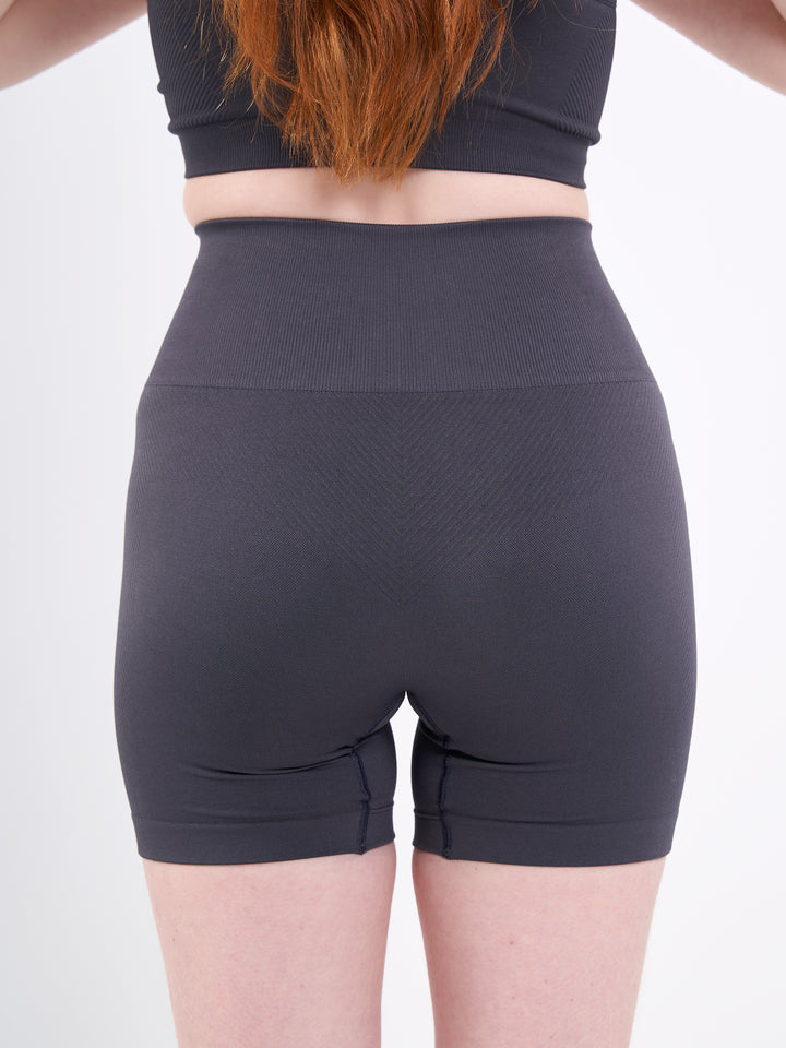 A Woman Wearing Anthracite Color Zen Perfect Seamless High-Waist Shorts. Perfect Fit