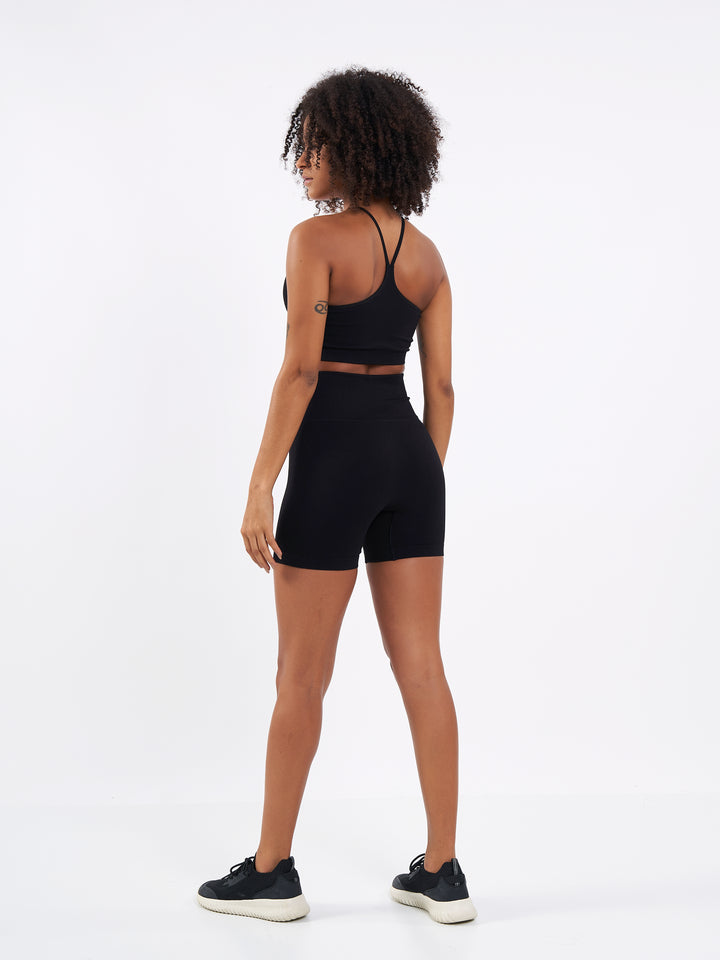 A Woman Wearing Deep Black Color Zen Perfect Seamless High-Waist Shorts. Perfect Fit