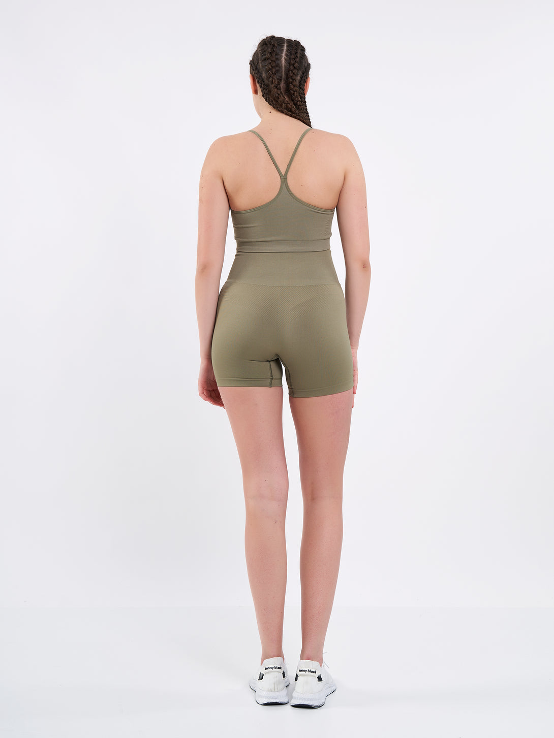 A Woman Wearing Olive Color Zen Perfect Seamless High-Waist Shorts. Perfect Fit
