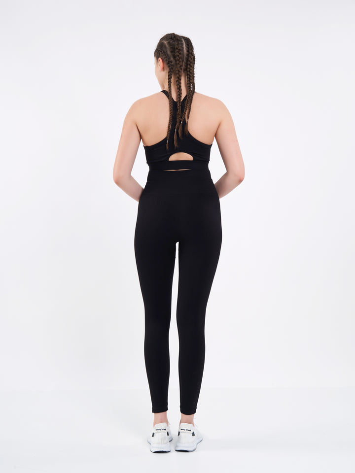 A Woman Wearing Deep Black Color Zen Perfect Seamless High-Waist Ankle-Length Leggings. Perfect Fit