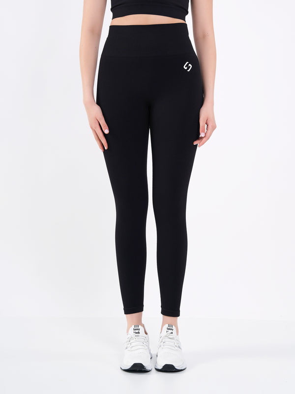 Color_Black Beauty | A Woman Wearing Deep Black Color Zen Perfect Seamless High-Waist Ankle-Length Leggings. Perfect Fit