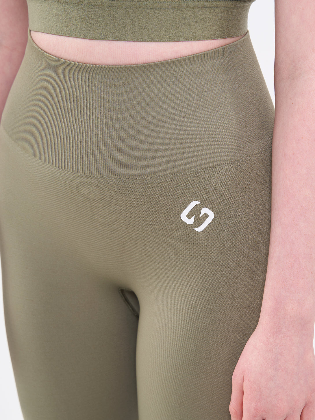 A Woman Wearing Olive Color Zen Perfect Seamless High-Waist Ankle-Length Leggings. Perfect Fit