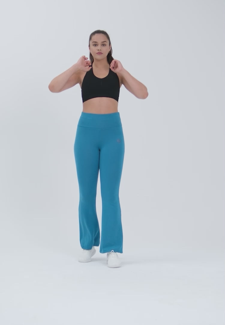 Color_Saxony Blue | A Woman Wearing Saxony Blue Color Legacy Jersey Yoga Pants