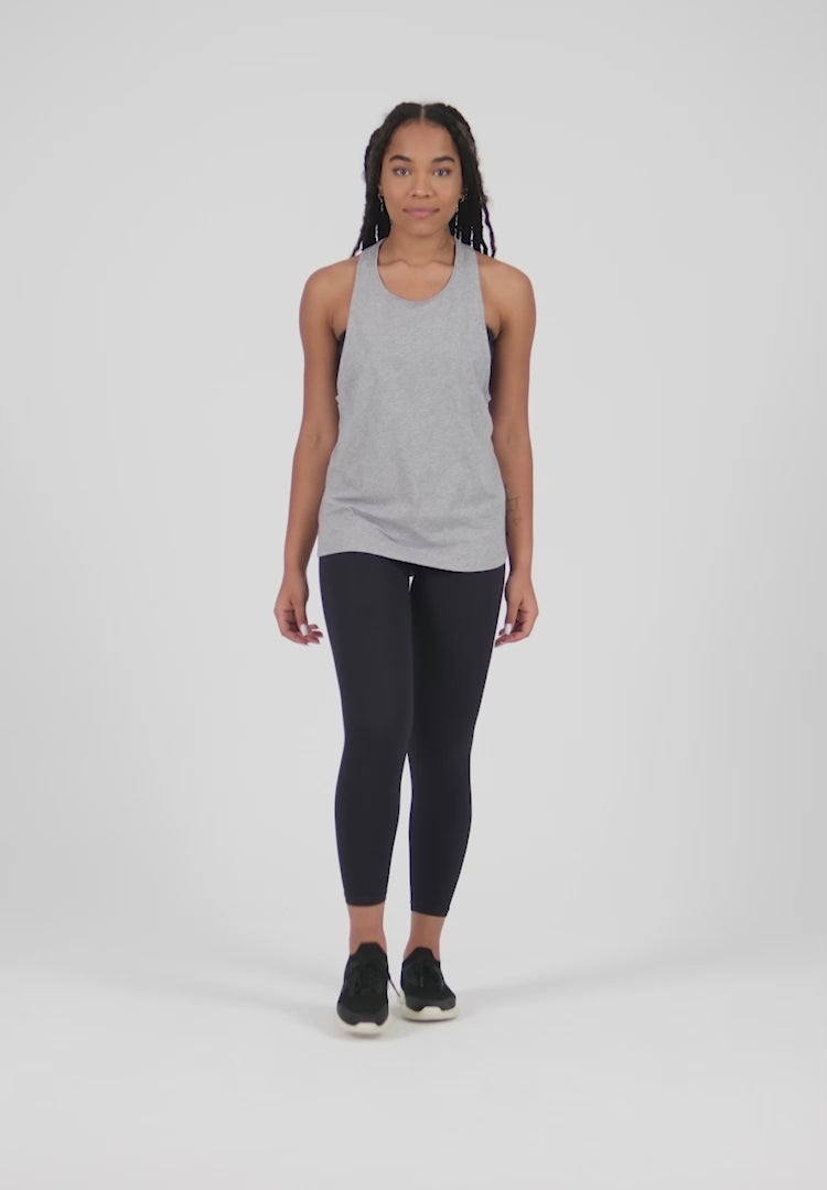 A Woman Wearing White Color Sport Jersey Tank Top & Tube Bra Set