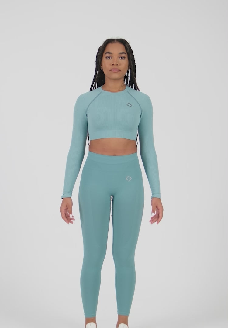 A Woman Wearing Amparo Blue Color The Main Long Sleeve Crop Top