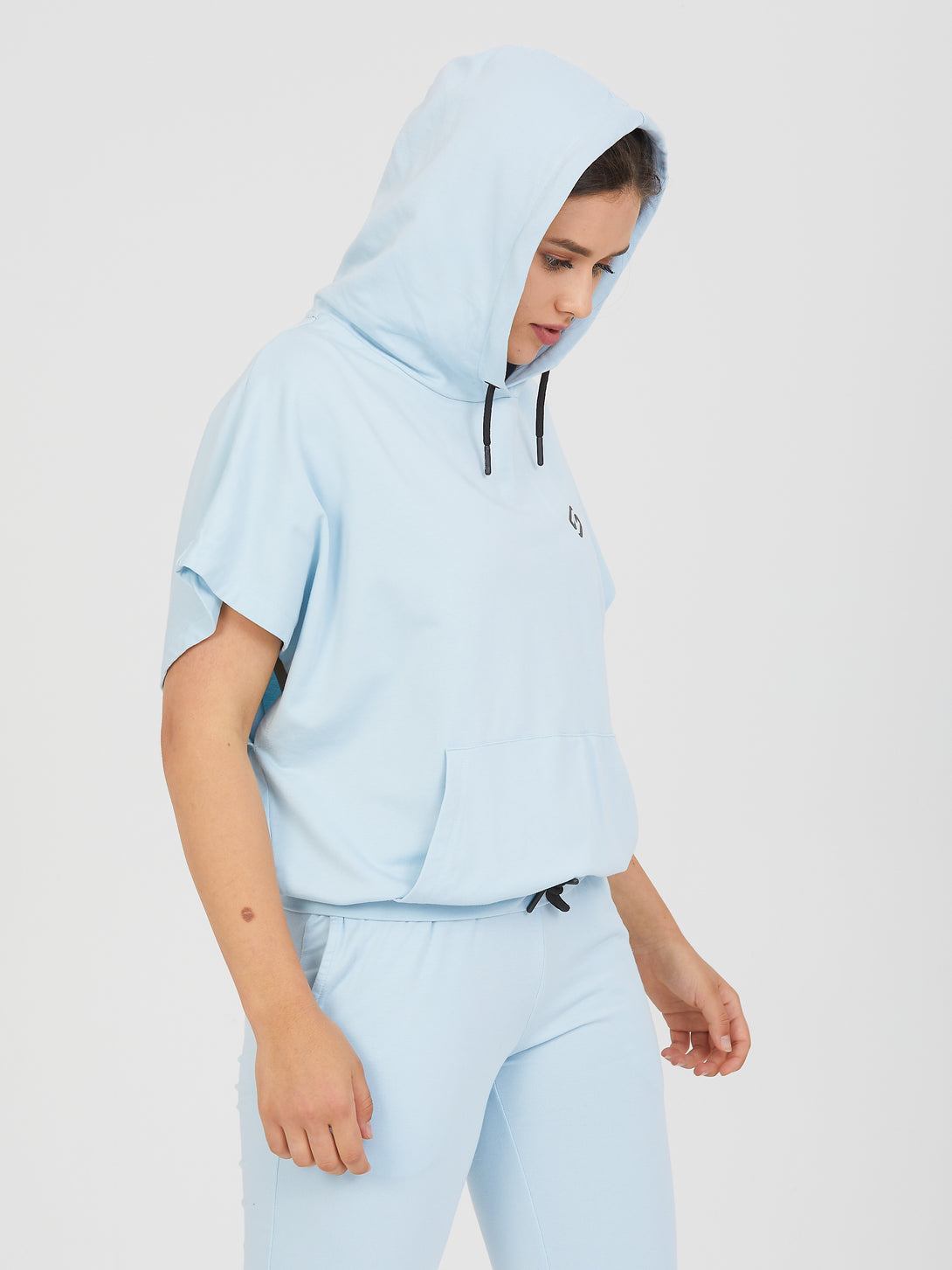 A Woman Wearing Baby Blue Color All-Day Essential Sweatshirt