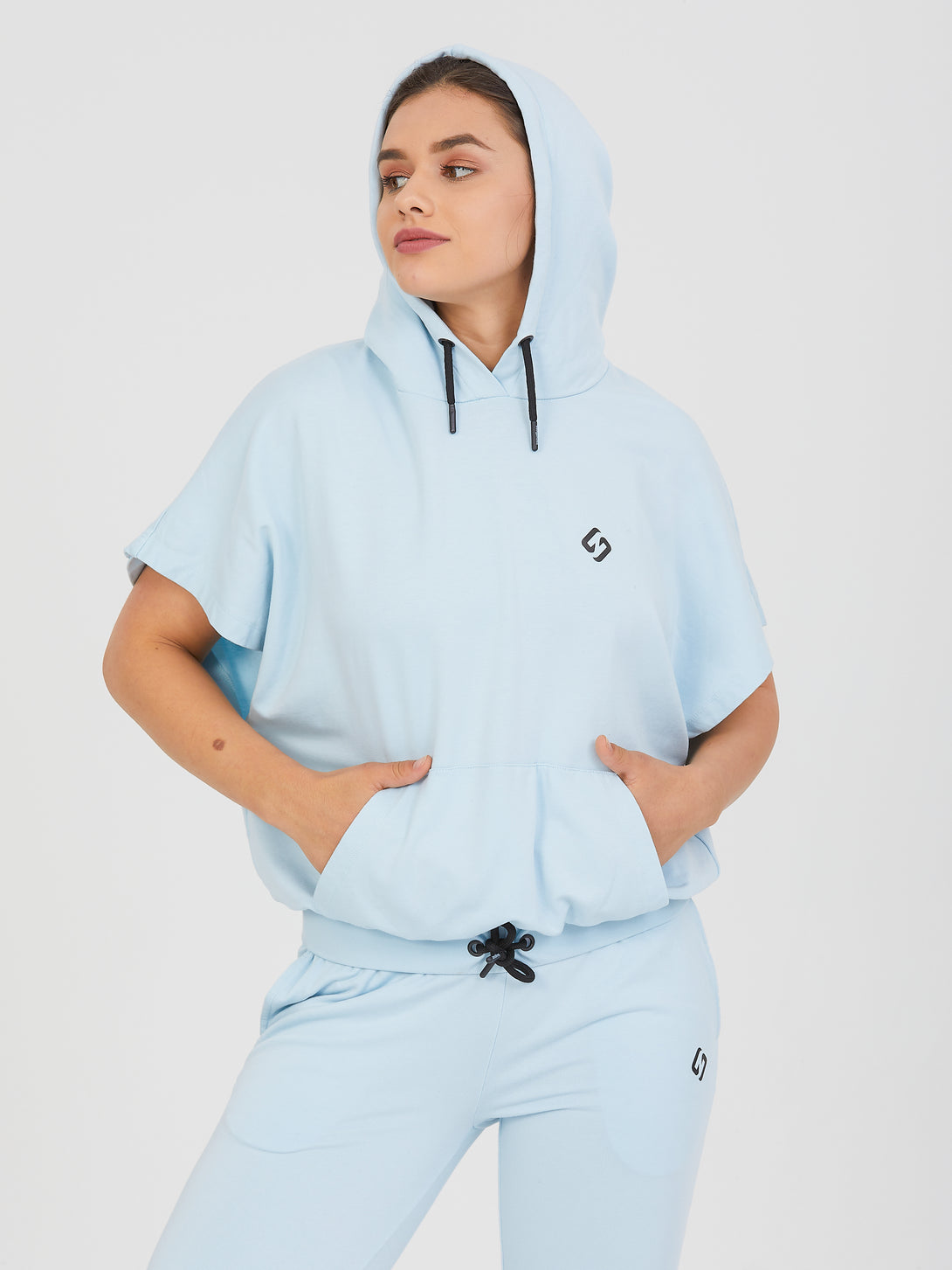A Woman Wearing Baby Blue Color All-Day Essential Sweatshirt