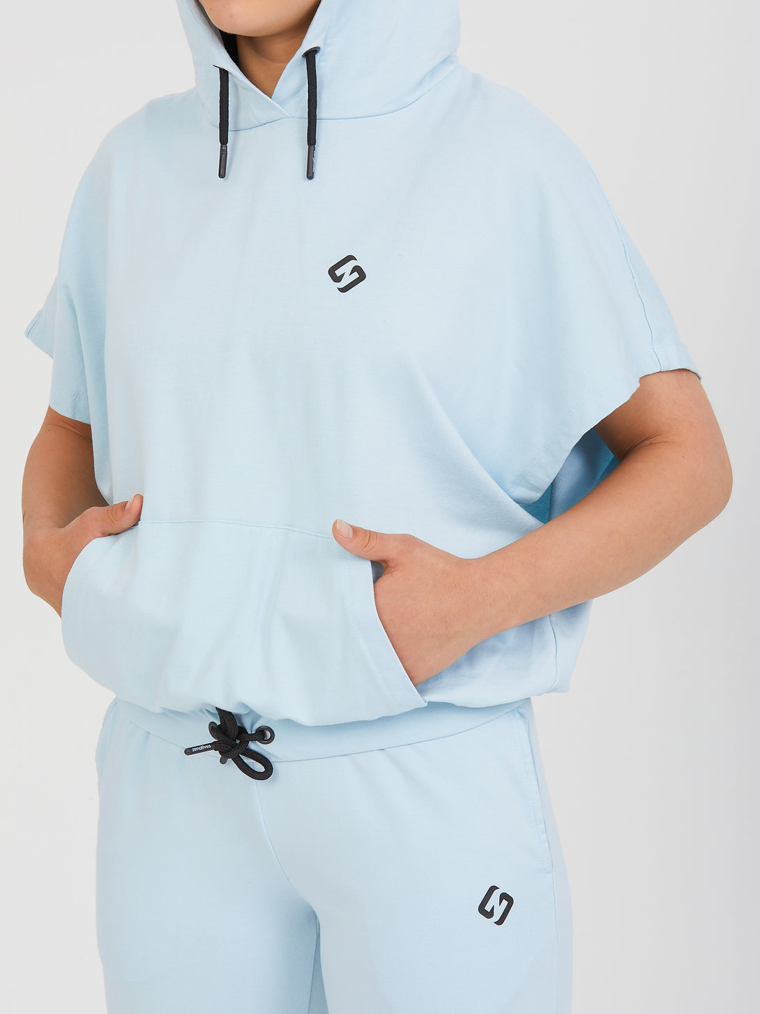 A Woman Wearing Baby Blue Color All-Day Essential Sweatshirt