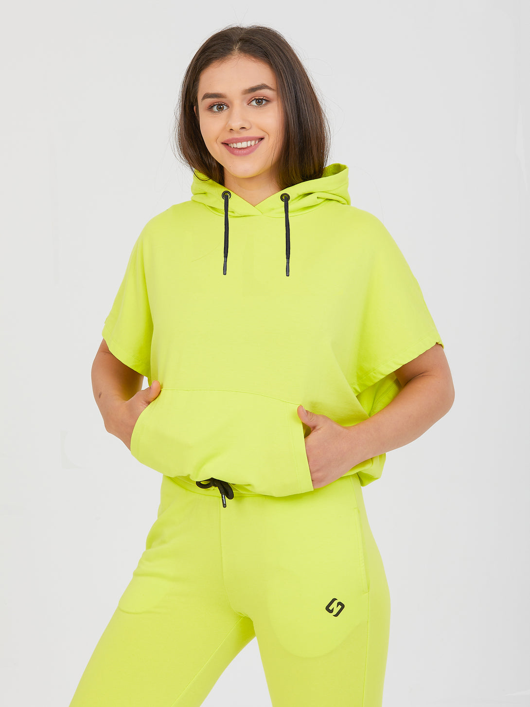 A Woman Wearing Limeade Color All-Day Essential Sweatshirt
