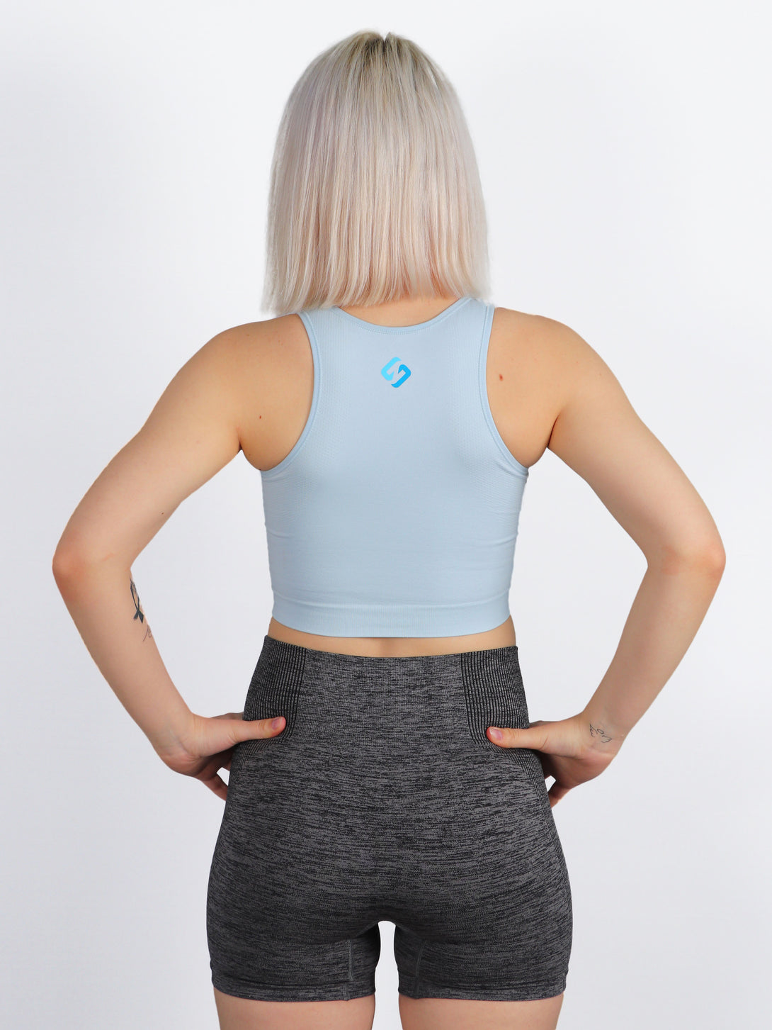 A Woman Wearing Baby Blue Color All-Day Seamless Sleeveless Crop Top