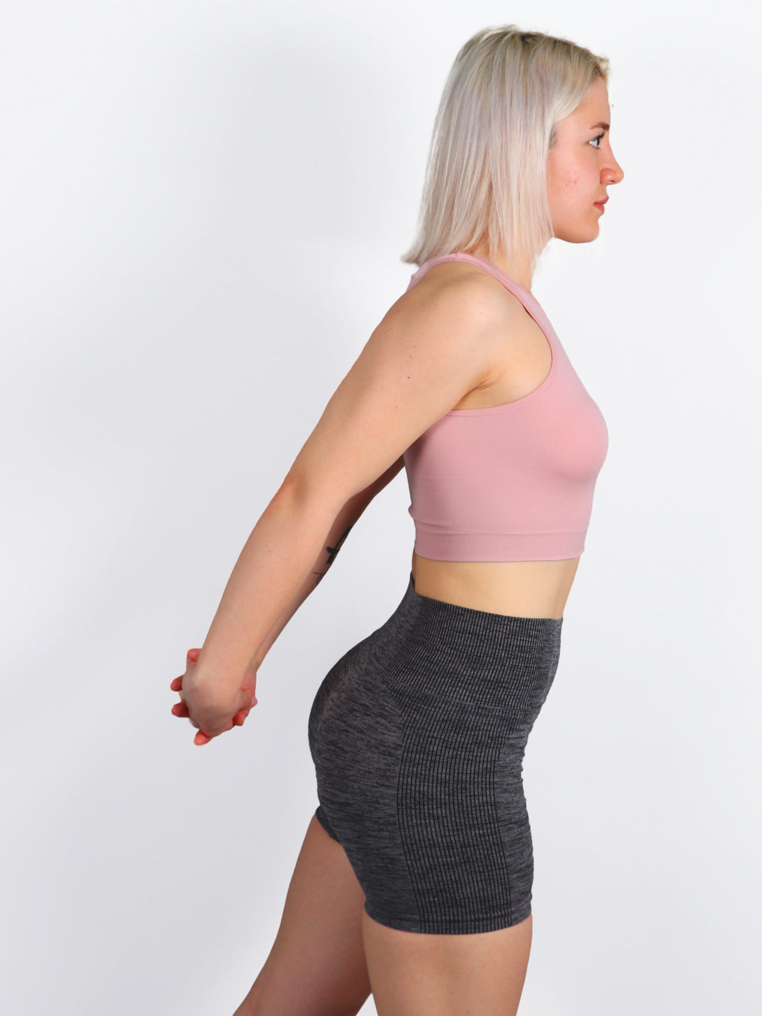 A Woman Wearing Pale Mauve Color All-Day Seamless Sleeveless Crop Top