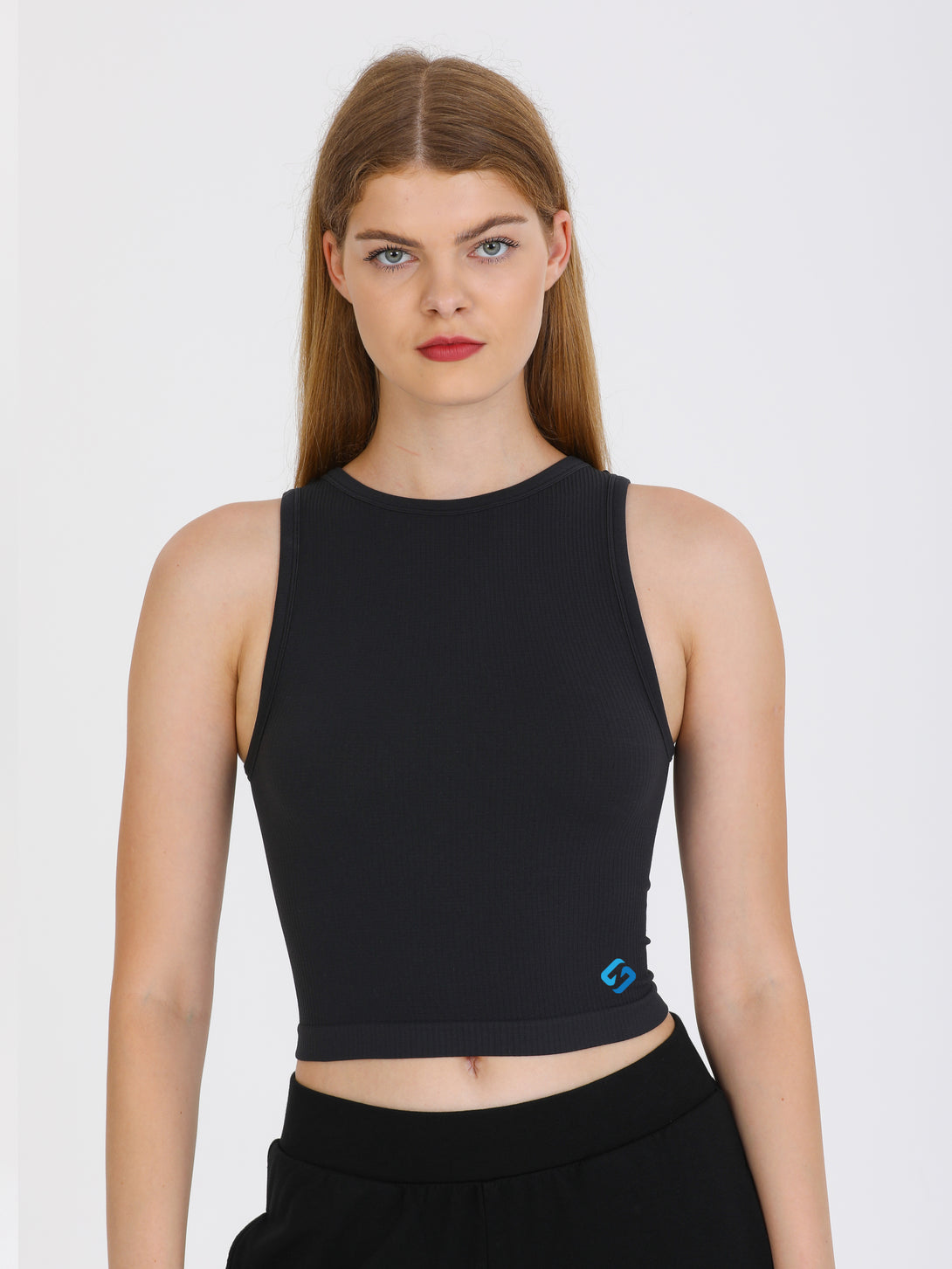 A Woman Wearing Black Color All-Day Sleeveless Strapped Crop Top