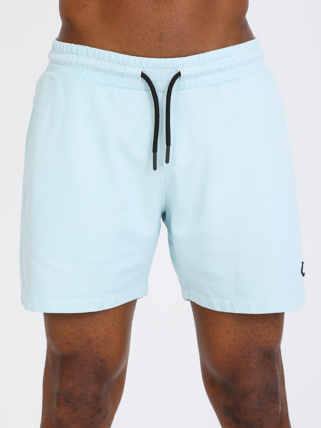 A Man Wearing Baby Blue Color Essential Mens Workout Shorts