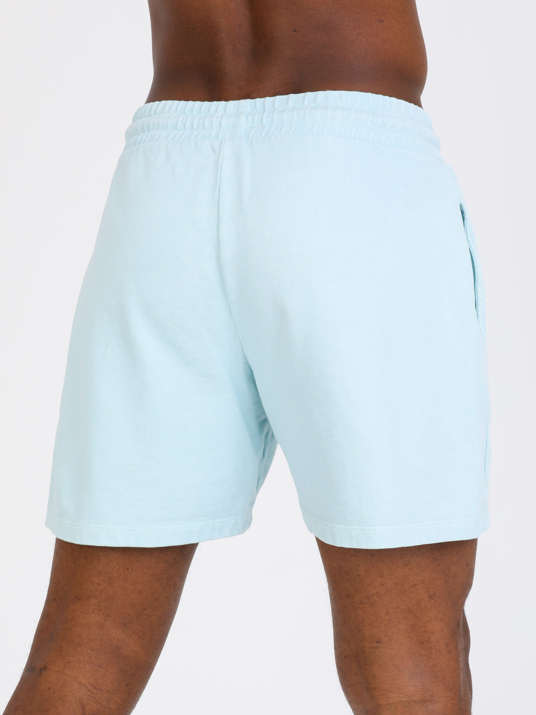 A Man Wearing Baby Blue Color Essential Mens Workout Shorts