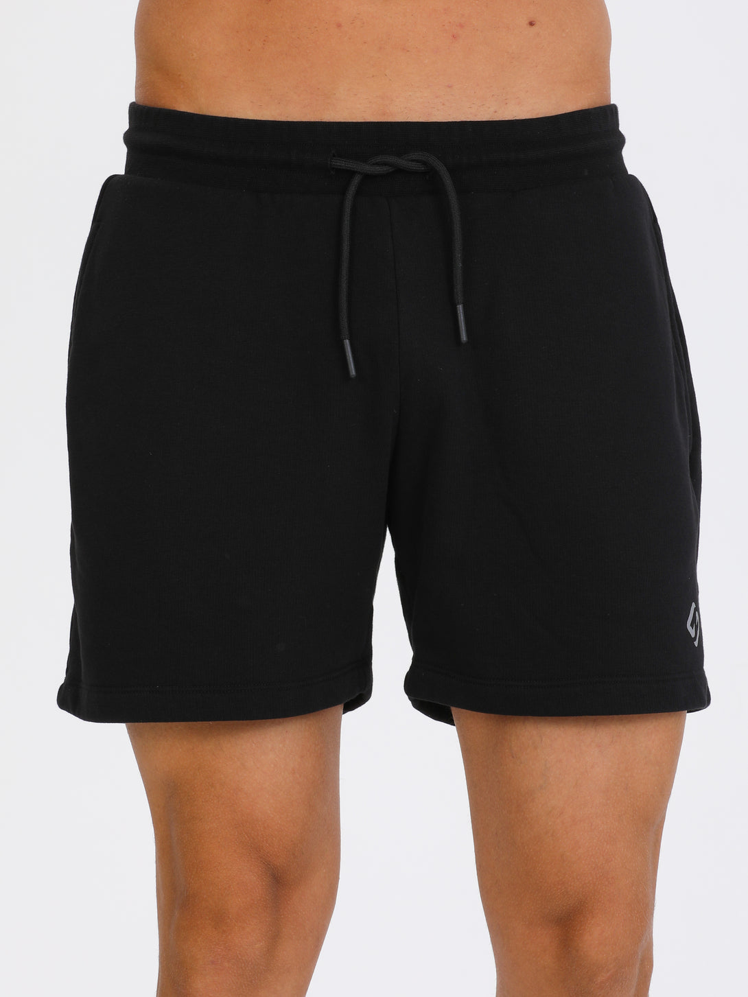 A Man Wearing Black Color Essential Mens Workout Shorts
