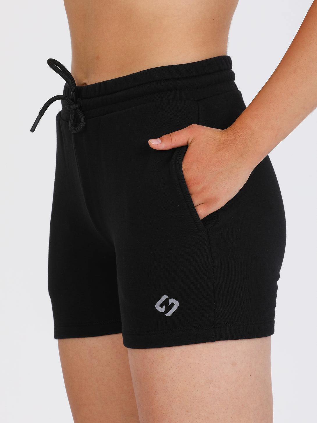 A Woman Wearing Black Color Essential Womens Workout Shorts