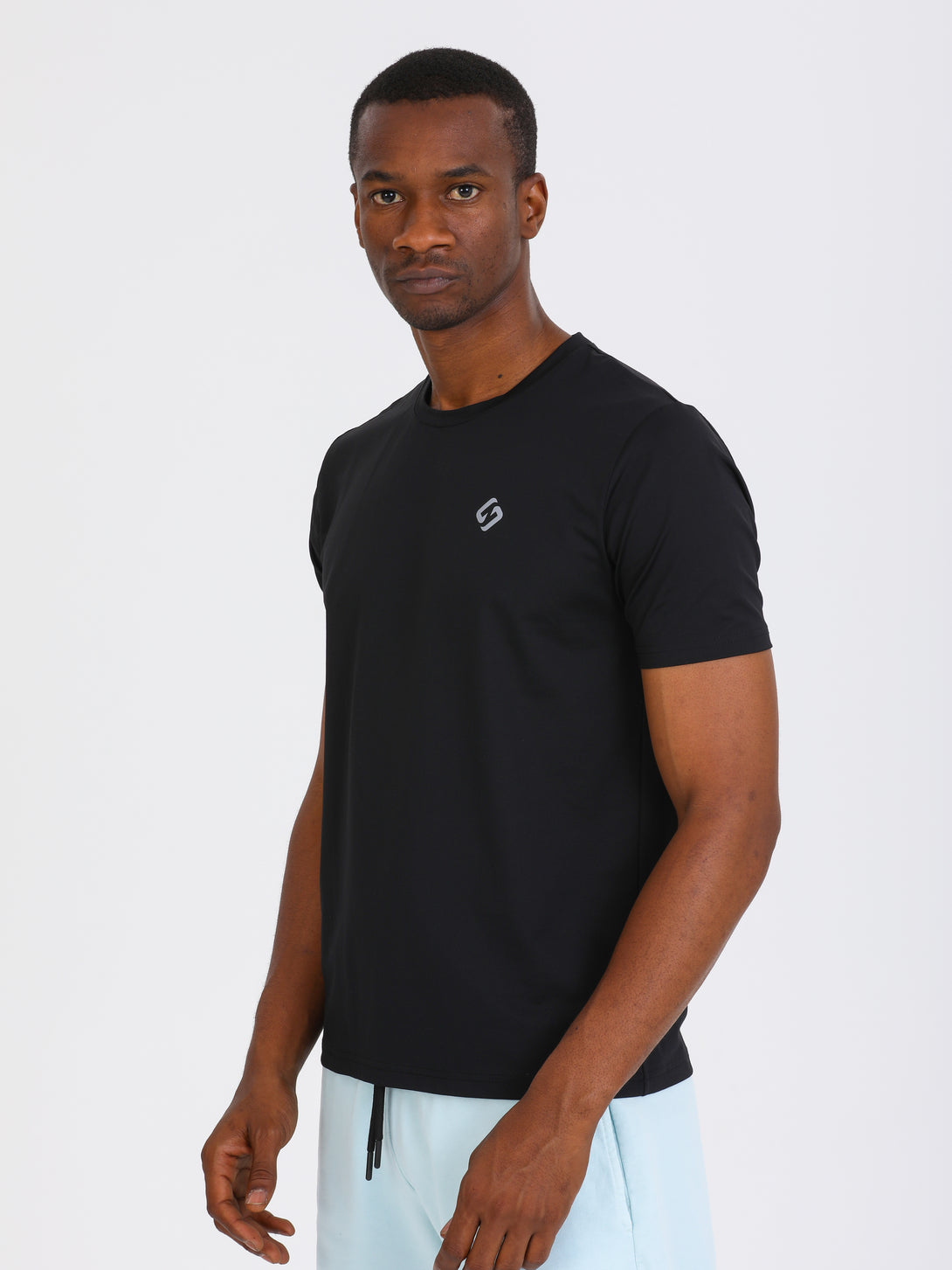 A Man Wearing Black Color Essential Workout T-Shirt