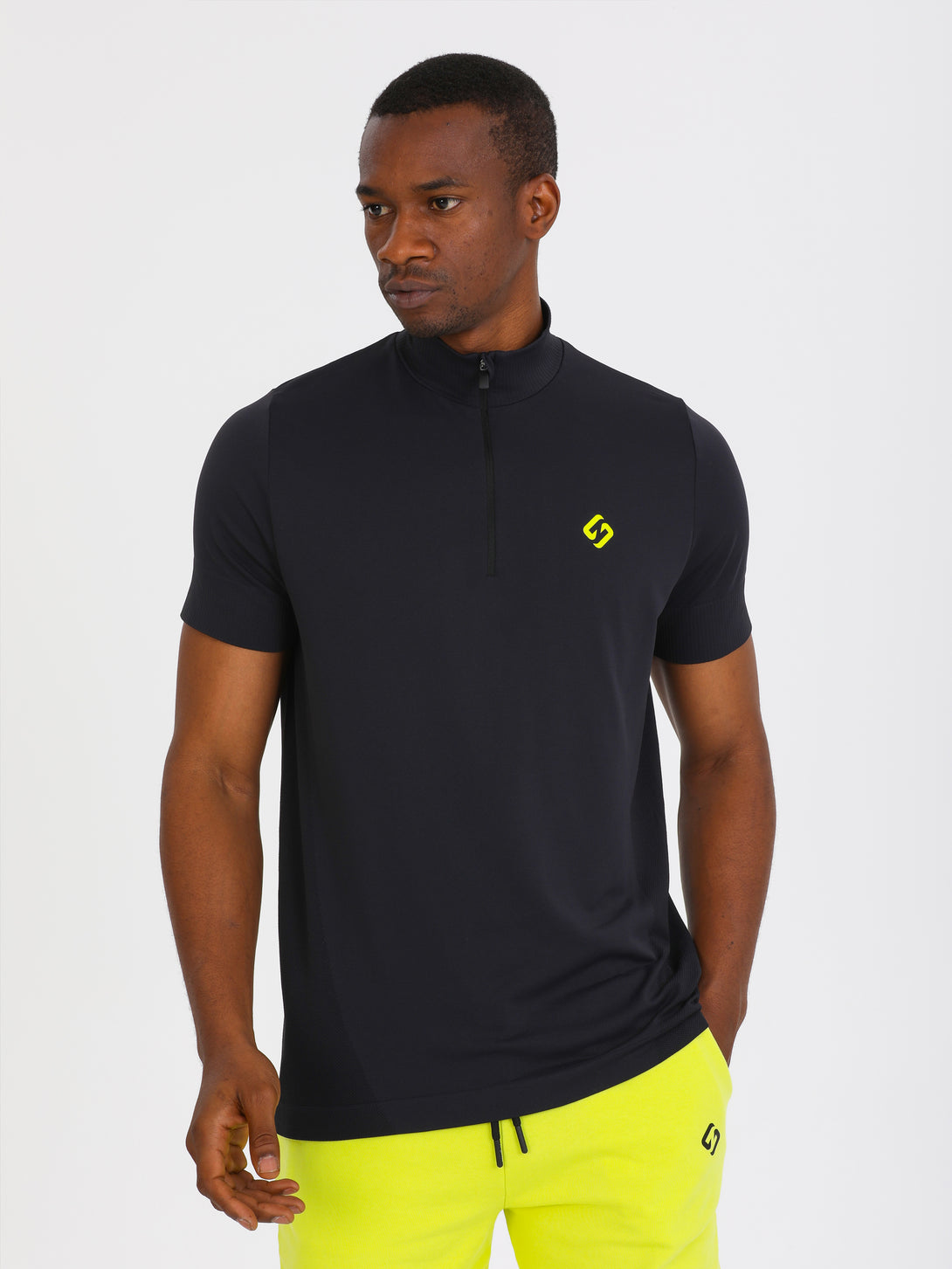 A Man Wearing Black Color Seamless Short Sleeve Zipped T-Shirt