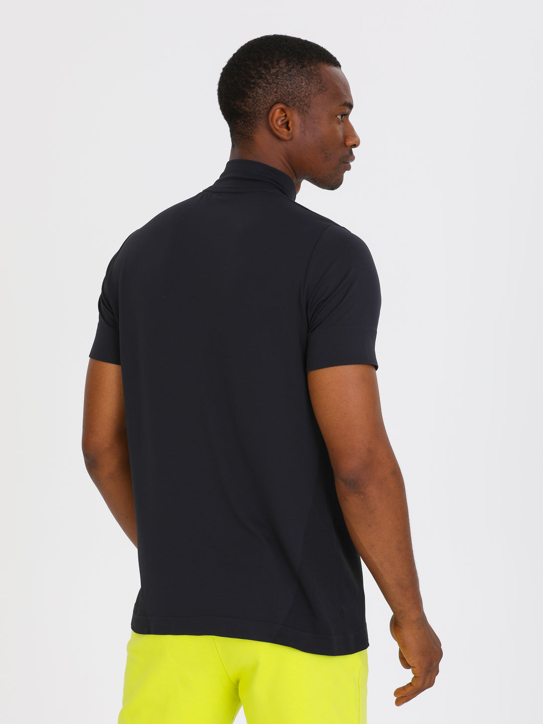 A Man Wearing Black Color Seamless Short Sleeve Zipped T-Shirt