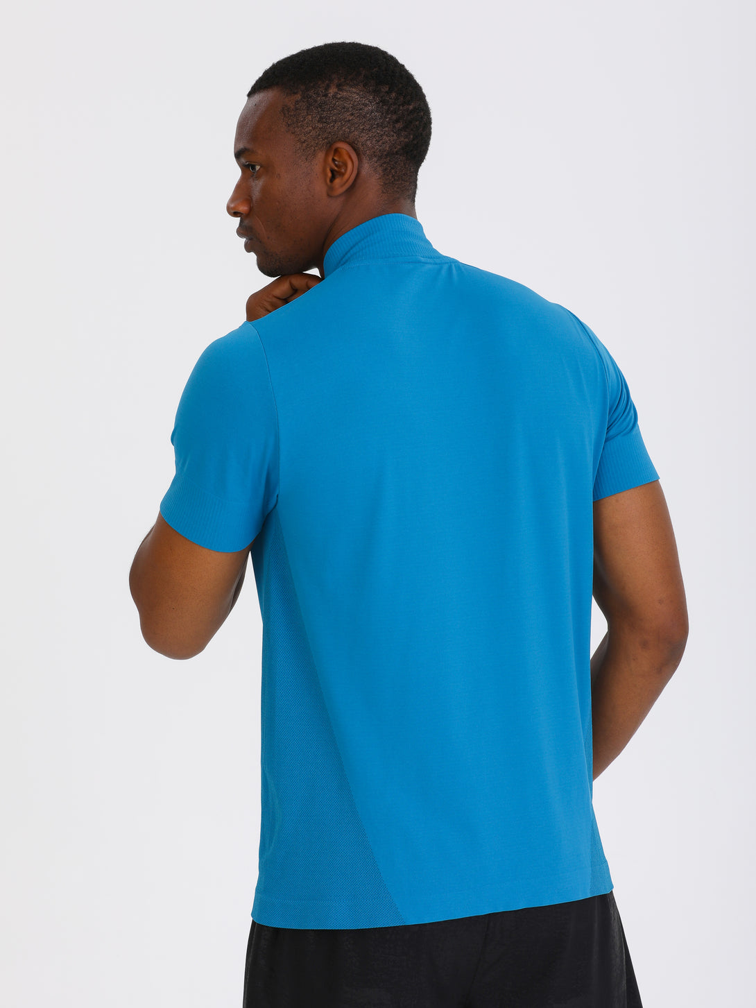 A Man Wearing Saxony Blue Color Seamless Short Sleeve Zipped T-Shirt