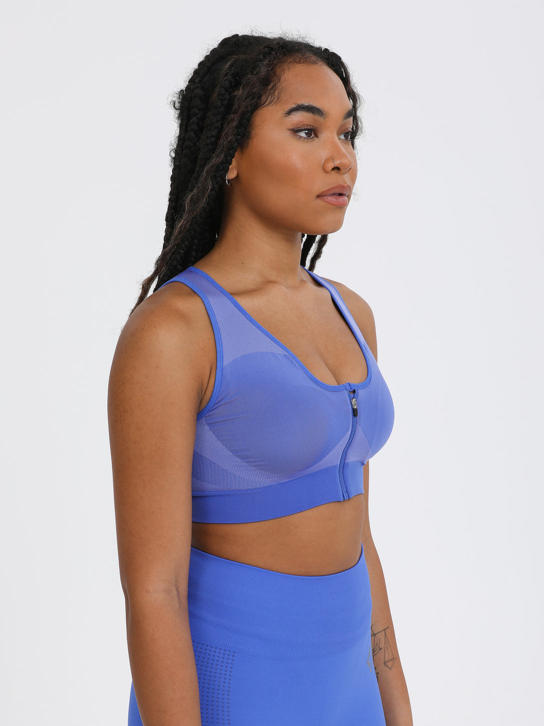 A Woman Wearing Amparo Blue Color High Impact Sports Bra