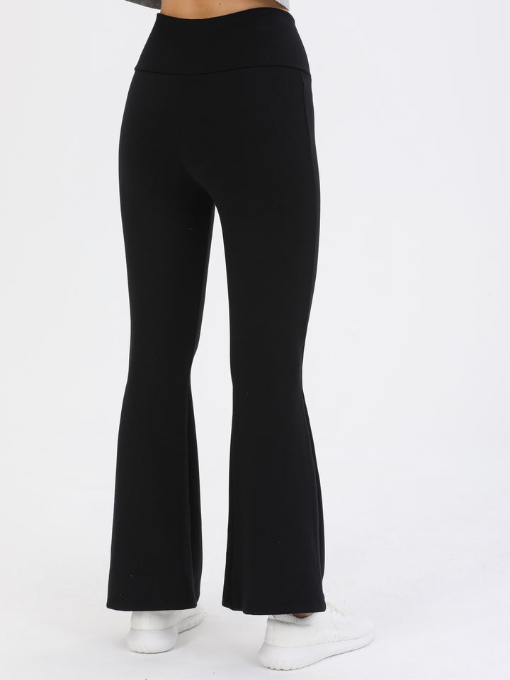 A Woman Wearing Black Color Legacy Jersey Yoga Pants