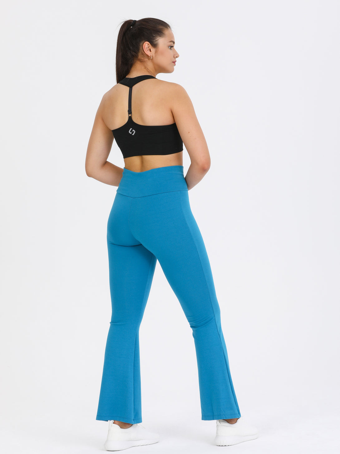 A Woman Wearing Saxony Blue Color Legacy Jersey Yoga Pants