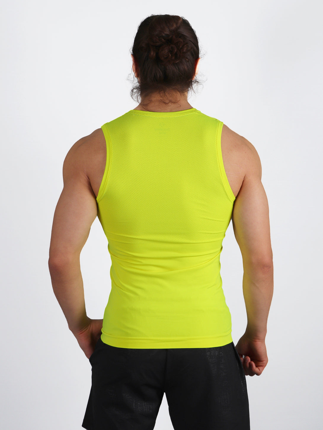 A Man Wearing Lime Color Seamless Mens Mesh Tank Top
