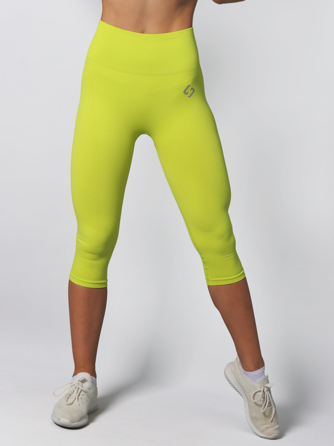 A Woman Wearing Lime Color Seamless Capri Legging