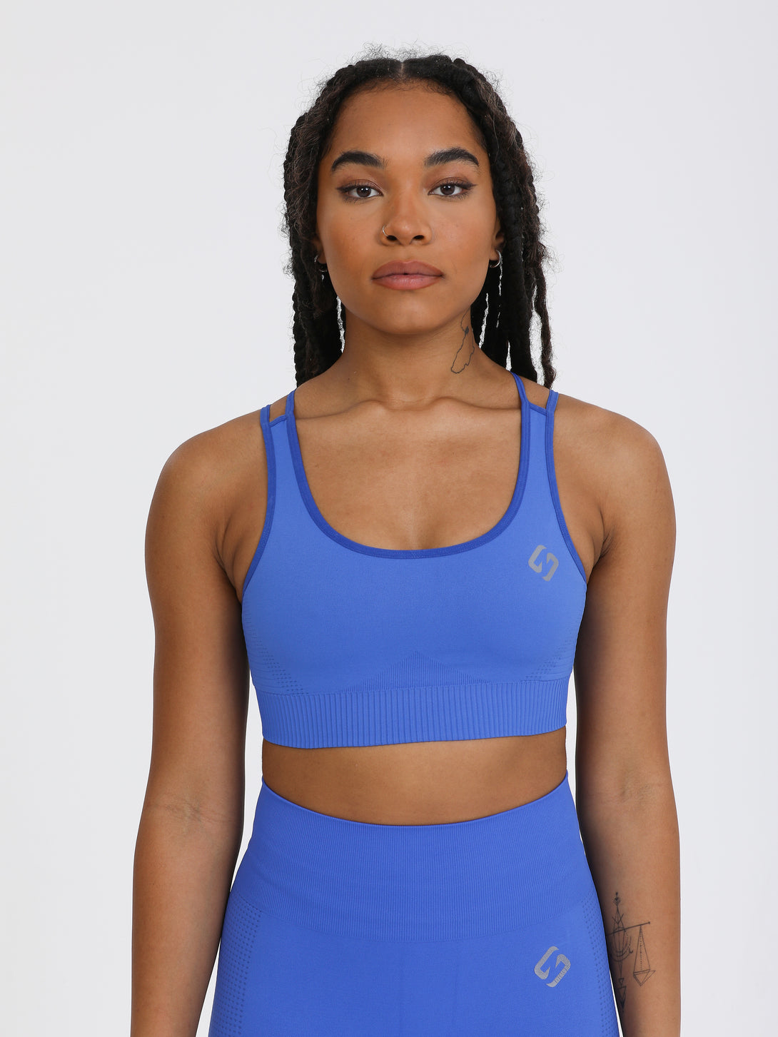 A Woman Wearing Amparo Blue Color Seamless Light Support Sports Bra