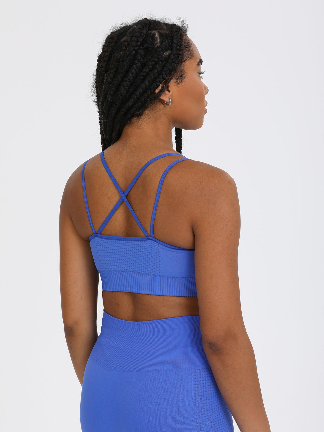 A Woman Wearing Amparo Blue Color Seamless Light Support Sports Bra