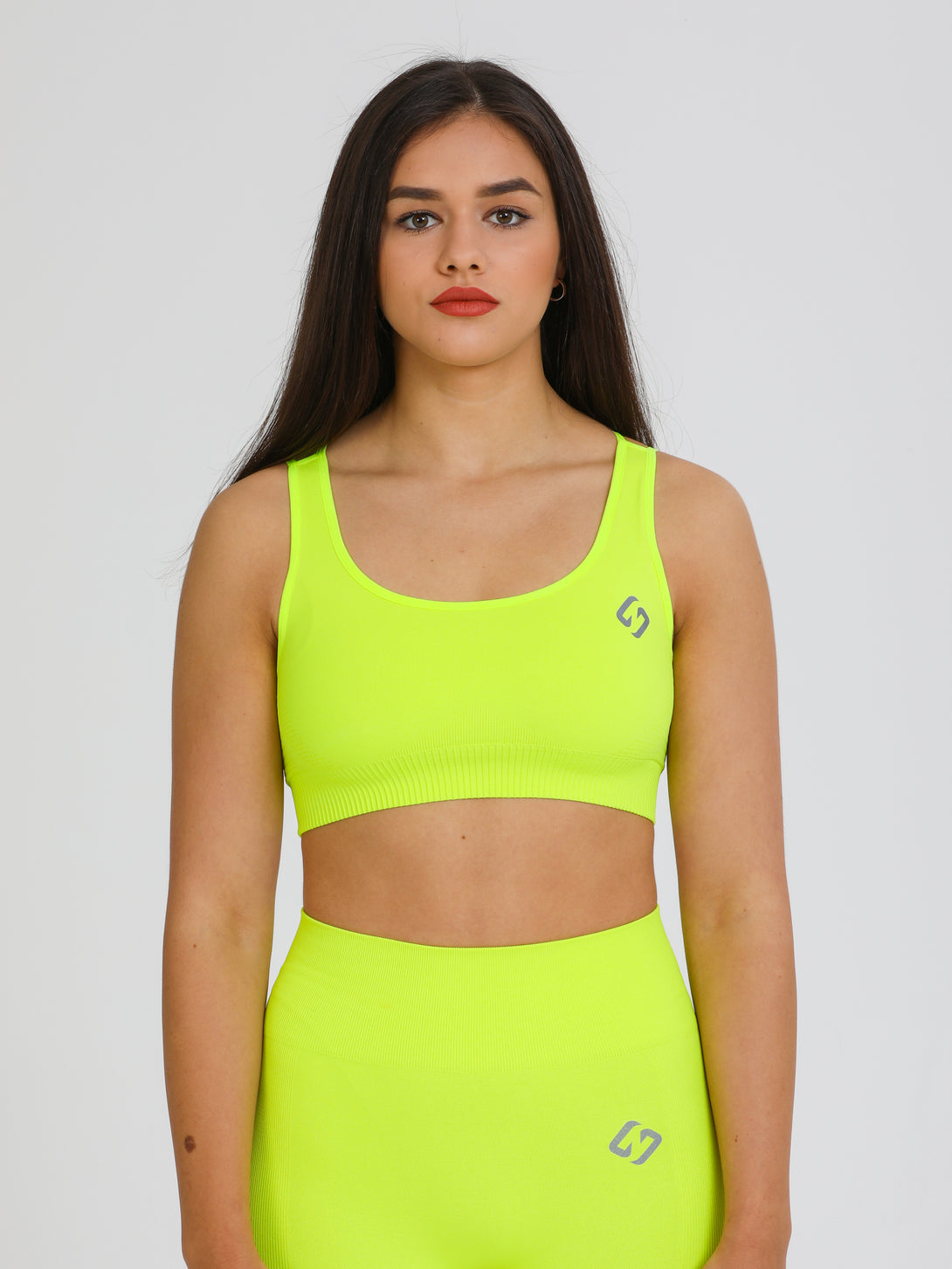 A Woman Wearing Lime Color Seamless Light Support Sports Bra