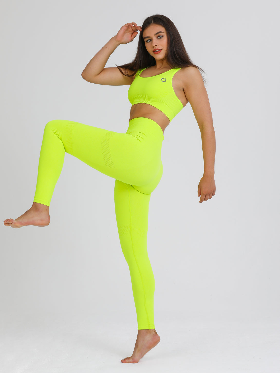A Woman Wearing Lime Color Seamless Light Support Sports Bra
