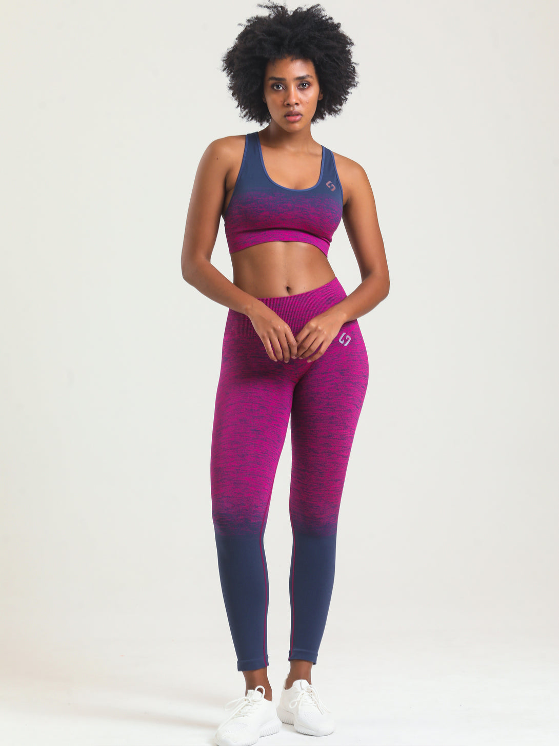 A woman wearing Beetroot Purple color Seamless Ombre Medium Support Sports Bra