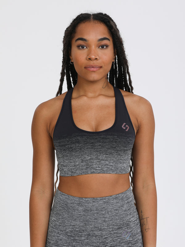 Color_ Black | A woman wearing black color Seamless Ombre Medium Support Sports Bra