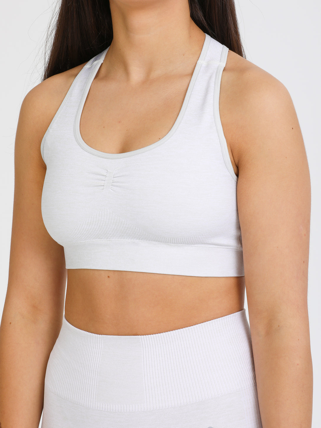 A Woman Wearing Light Grey Color Seamless Medium Support Sports Bra