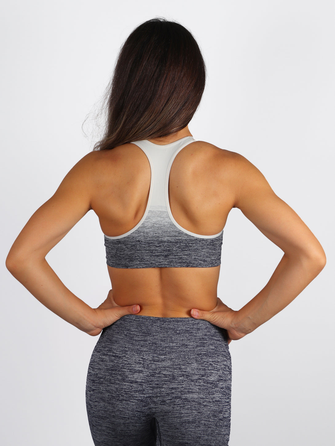 A woman wearing Peacoat color Seamless Ombre Medium Support Sports Bra